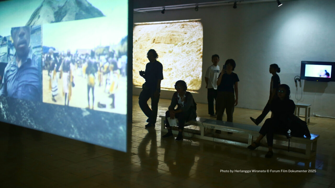 A picture of people watching an exhibition.